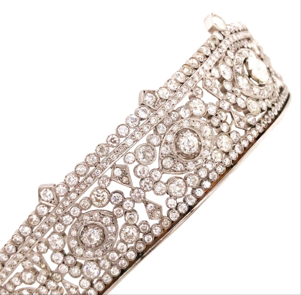 Platinum Diamond Tiara Metal: Platinum & 18K Gold
Diamonds: Three main stones approximately 1.45ct, 0.35ct, and 0.34ct; total diamond weight approximately 23.14ct