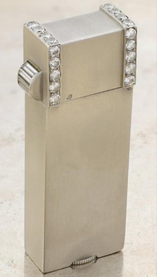 Ostertag Platinum and Diamond Lighter 28 circular and 5 baguette cuts with approximate total weight of 1.50 carats of diamonds circa 1930s