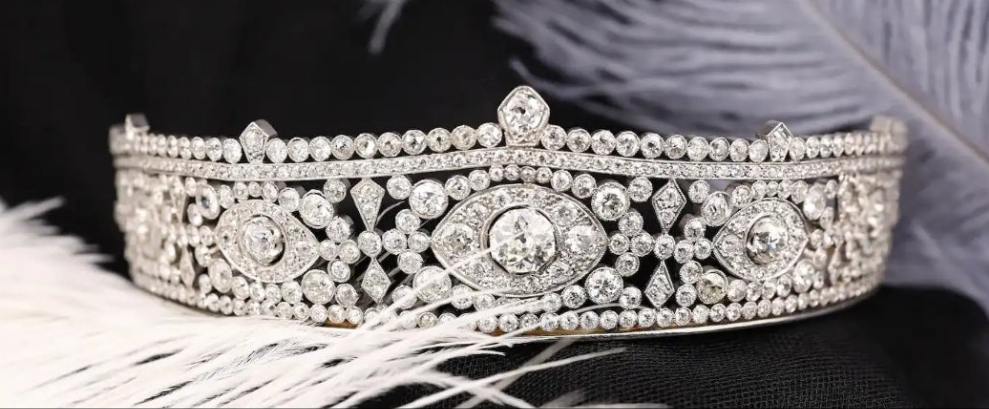 Platinum Diamond Tiara Metal: Platinum & 18K Gold
Diamonds: Three main stones approximately 1.45ct, 0.35ct, and 0.34ct; total diamond weight approximately 23.14ct