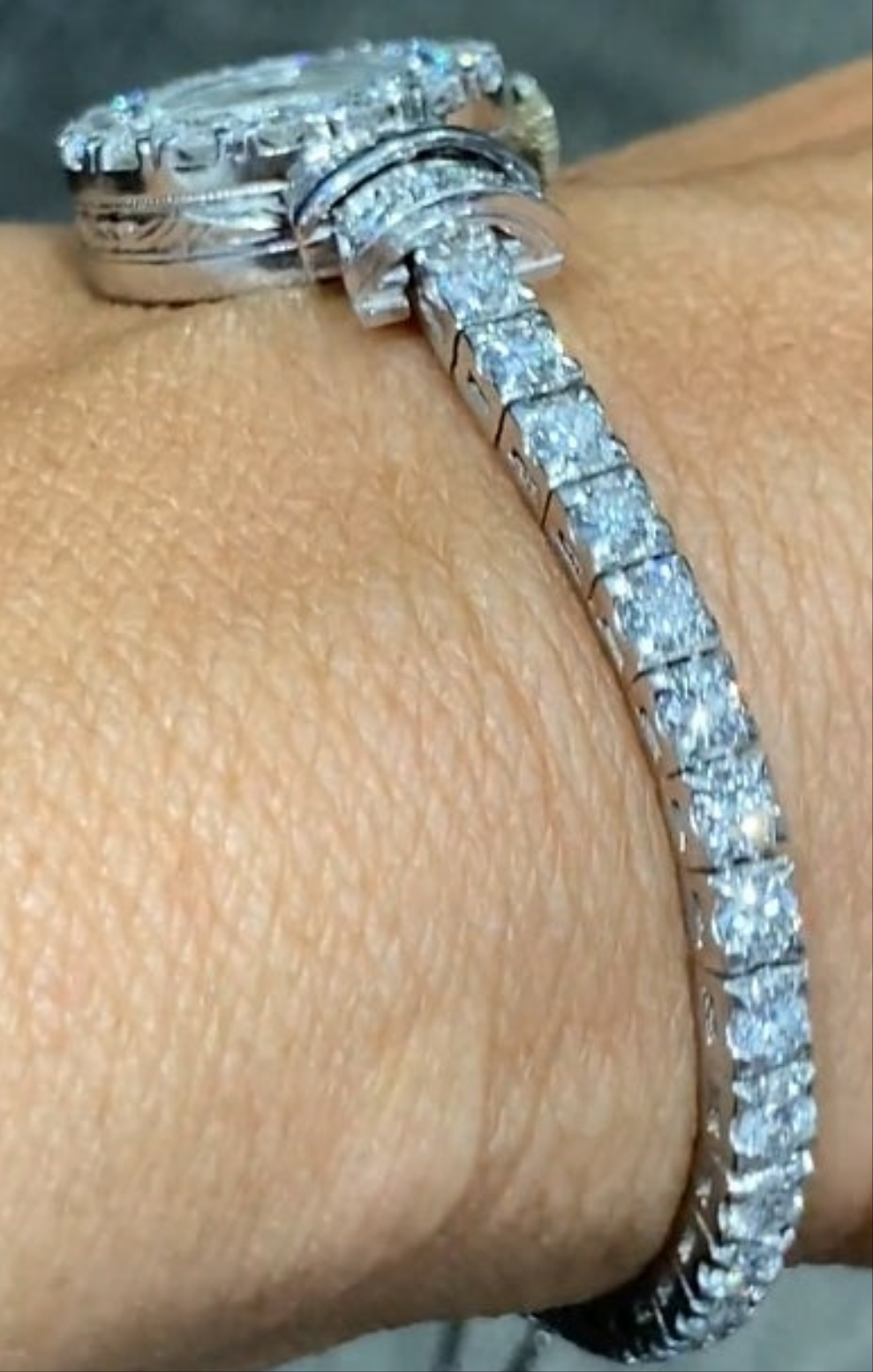 Elegent 1950s platinum and diamond 5 carat diamond watch wow