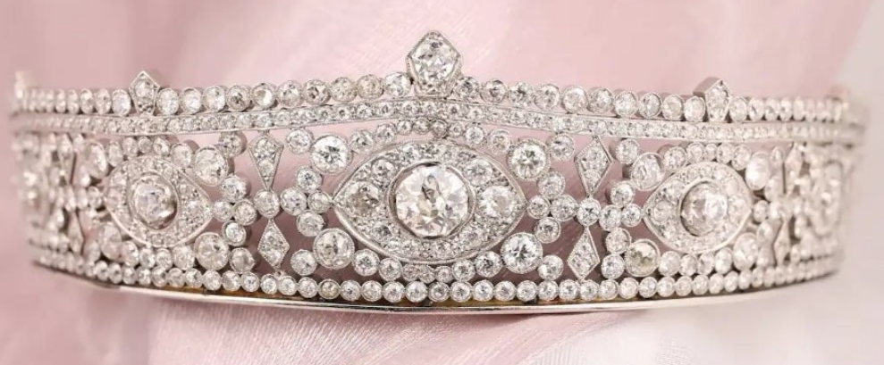 Platinum Diamond Tiara Metal: Platinum & 18K Gold
Diamonds: Three main stones approximately 1.45ct, 0.35ct, and 0.34ct; total diamond weight approximately 23.14ct