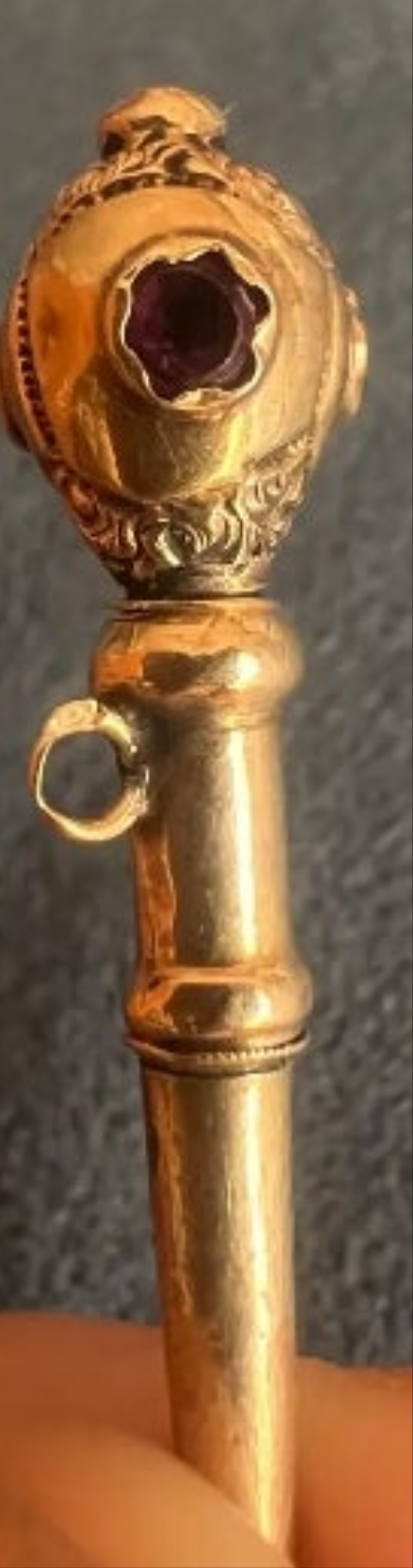 8k Gold French golden engraved pocket watch key that would look great even just as a pendant on a proper chain. It has delicate engravings on the top and three surrounded small ruby stones .