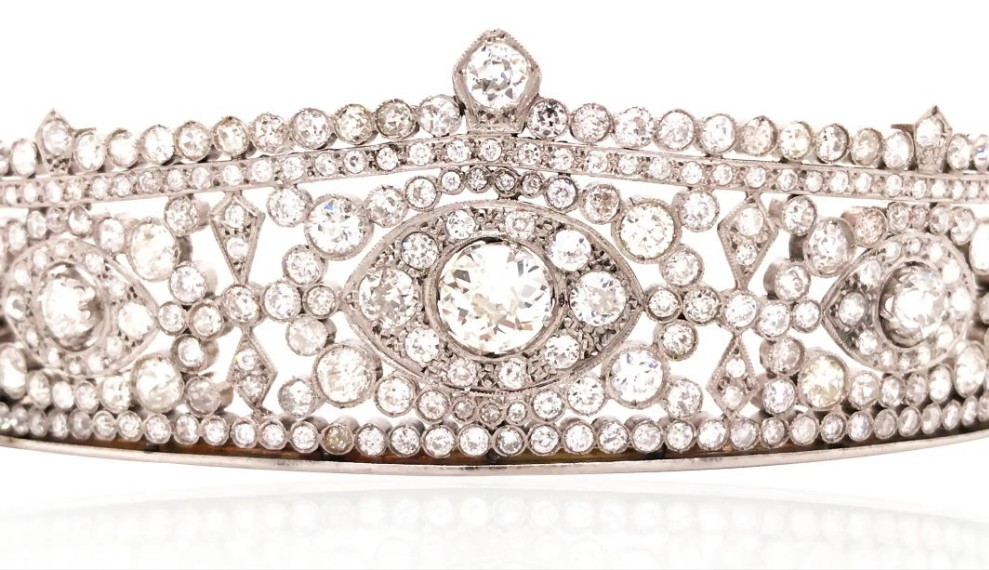 Platinum Diamond Tiara Metal: Platinum & 18K Gold
Diamonds: Three main stones approximately 1.45ct, 0.35ct, and 0.34ct; total diamond weight approximately 23.14ct