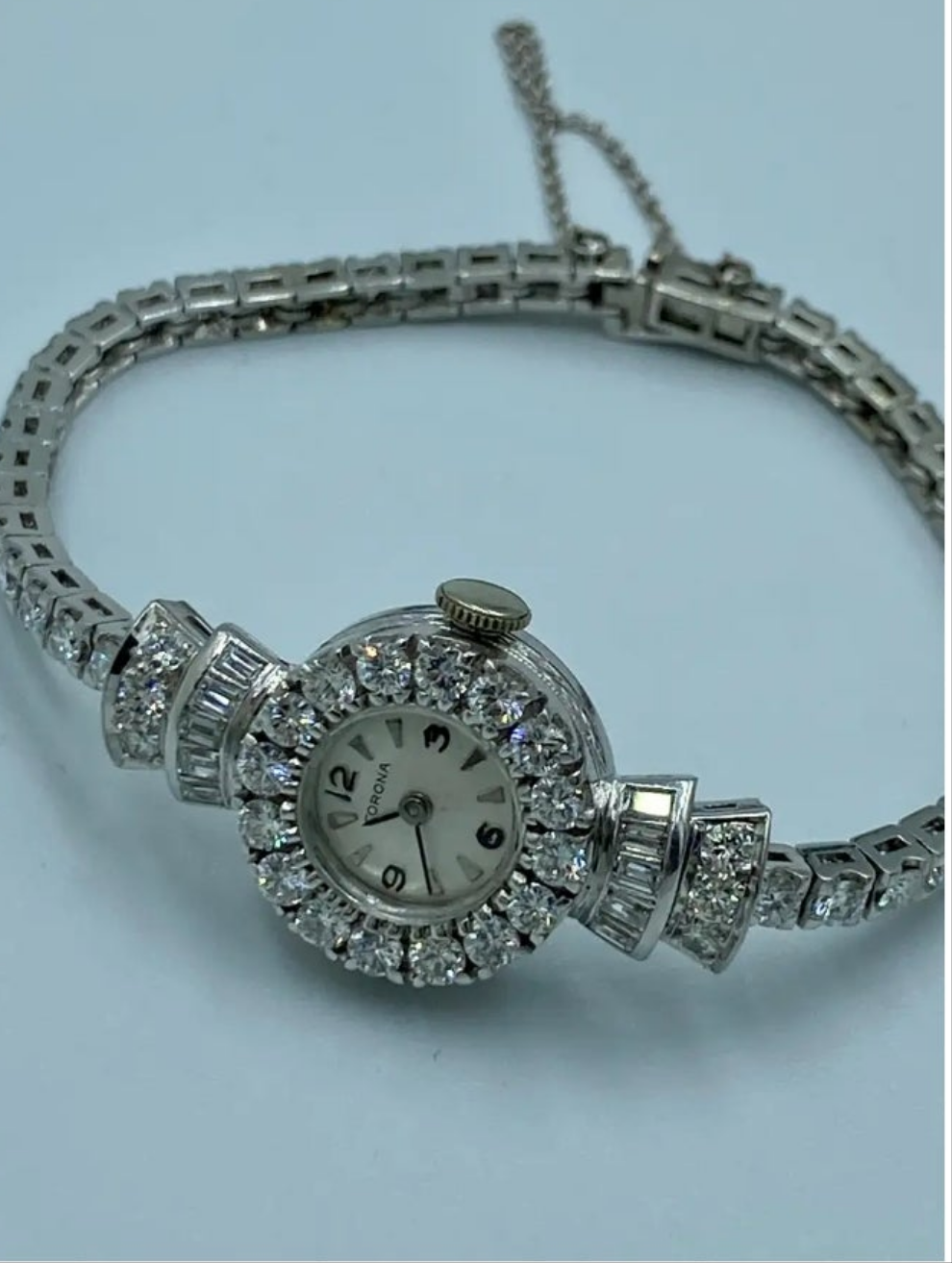 Elegent 1950s platinum and diamond 5 carat diamond watch wow