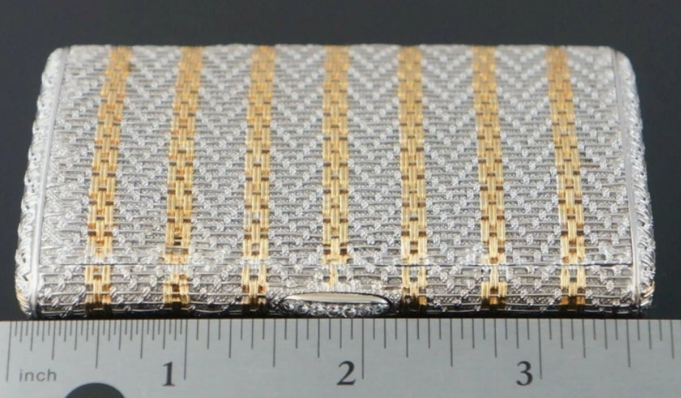 18k Gold .15 carat with a clarity grading of SI-1 and G/H in color. Rare Retro Two Tone Solid 18K Gold Weave & Link, & Diamond Accented Estate Cigarette Case