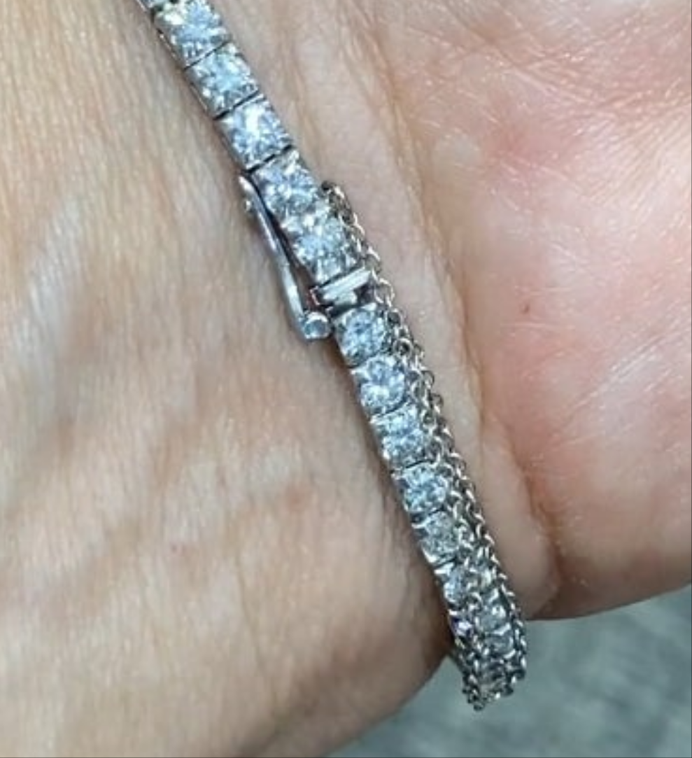 Elegent 1950s platinum and diamond 5 carat diamond watch wow