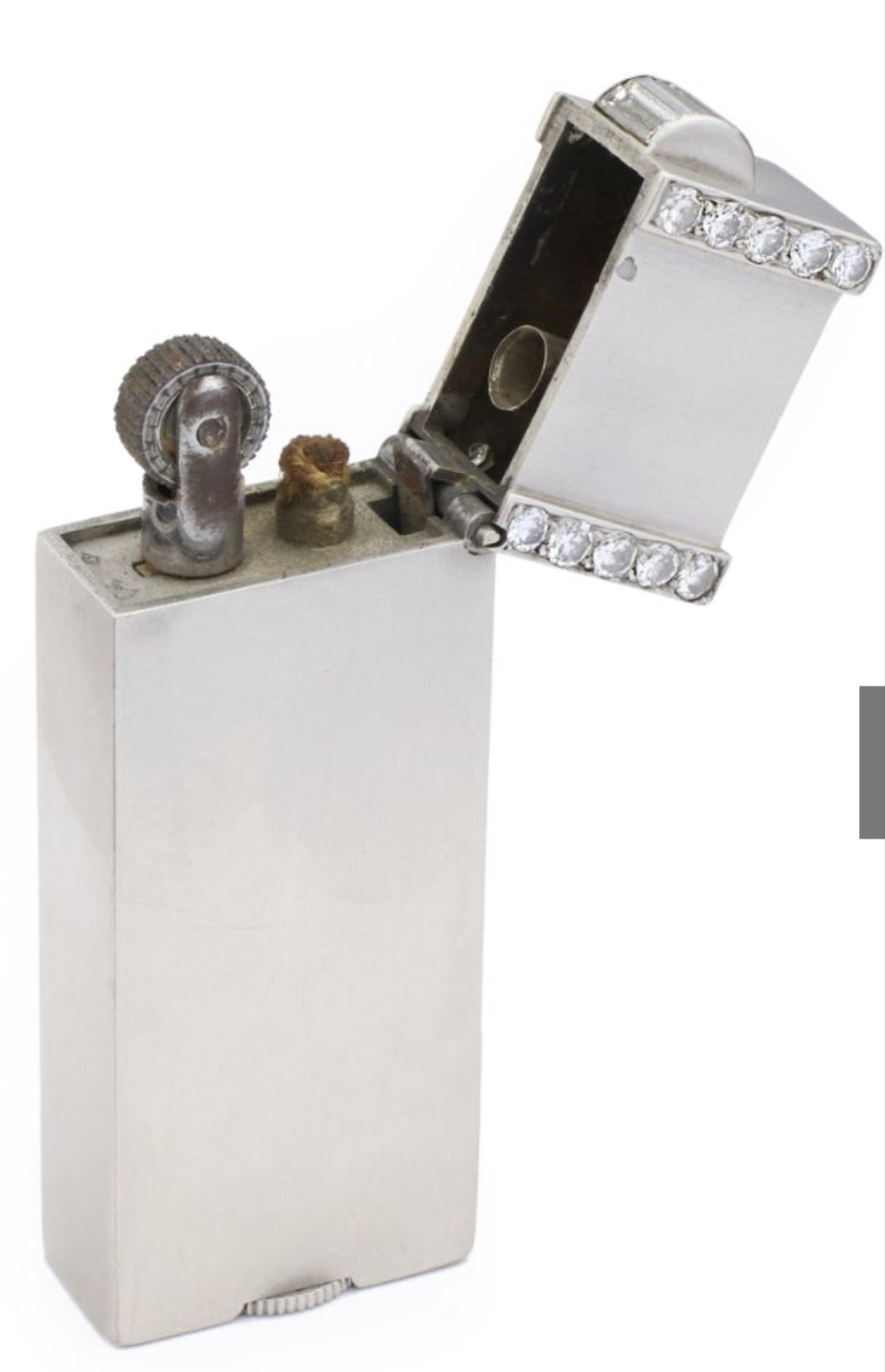 Ostertag Platinum and Diamond Lighter 28 circular and 5 baguette cuts with approximate total weight of 1.50 carats of diamonds circa 1930s
