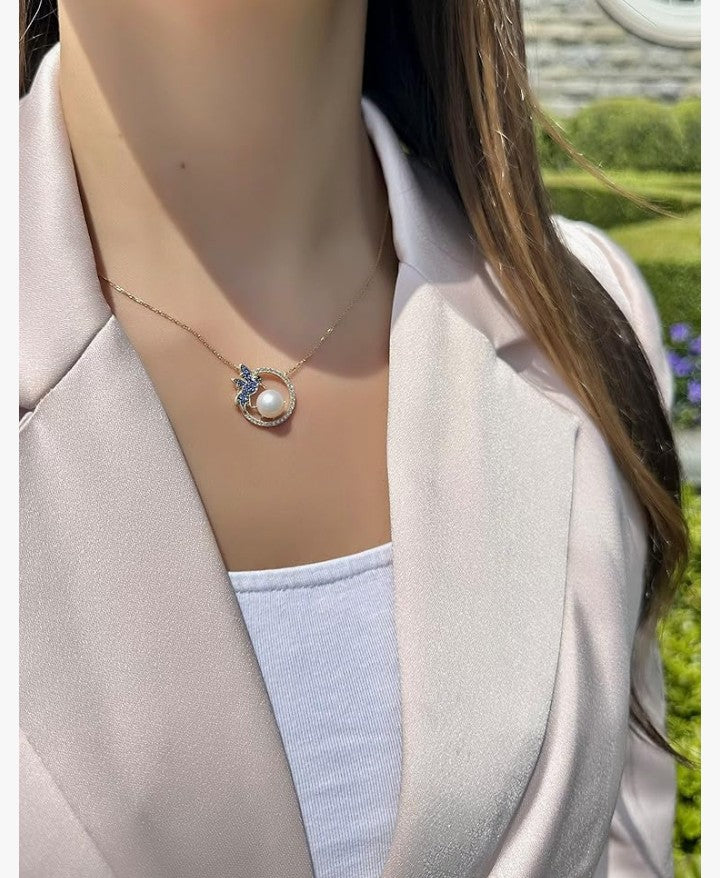 COCOMONEY 1/3 Carat Diamond Pearl, and 1/5 Carat Blue Sapphire Circle Hummingbird Pendant Necklace for Women in 14k Yellow Gold (White/Black, 0.53 cttw) on Adjustable Chain with Lobster Claw Clasp