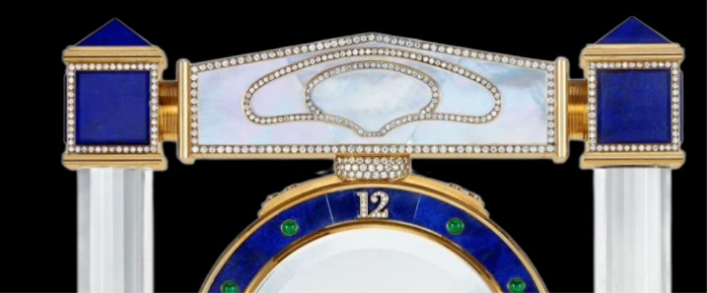 Diamond Mystery Clock Floating 2,150 grams of 18K yellow gold and it is adorned with an array of exceptional gemstones: two pear-shaped diamonds (3.02 and 1.79 carats), 49.96 carats of round-cut diamonds and 9.60 carats of cabochon emeralds.