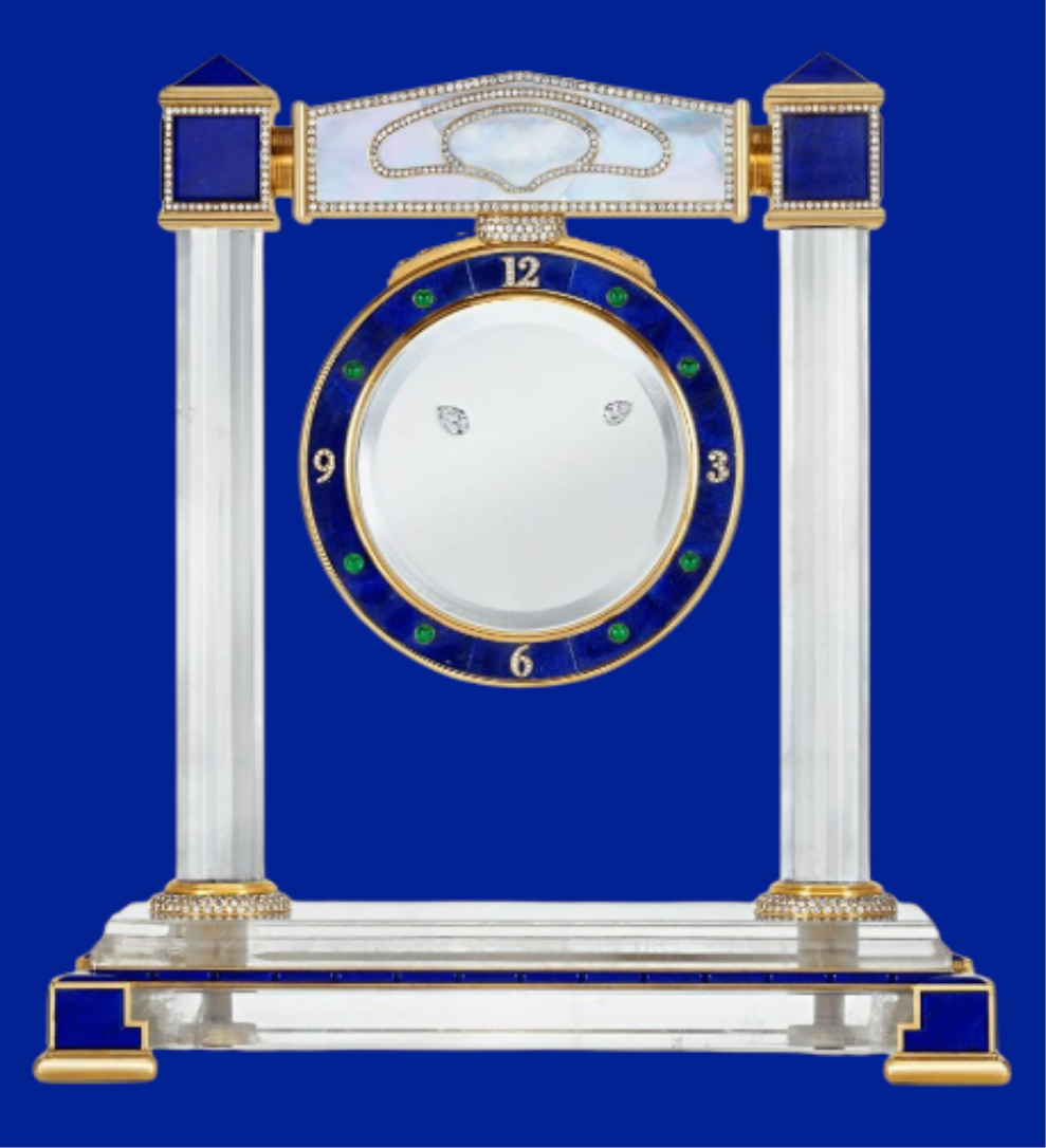 Diamond Mystery Clock Floating 2,150 grams of 18K yellow gold and it is adorned with an array of exceptional gemstones: two pear-shaped diamonds (3.02 and 1.79 carats), 49.96 carats of round-cut diamonds and 9.60 carats of cabochon emeralds.