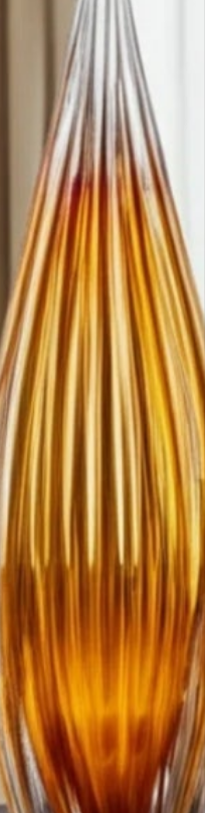 Handcrafted Glass Sculpture with Grooved Teardrop Design and Sleek Contemporary Silhouette Sculpture Decor