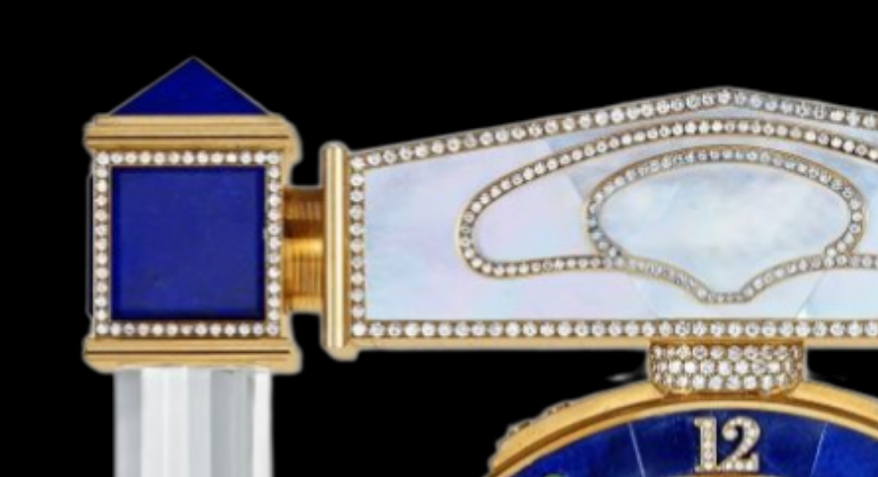 Diamond Mystery Clock Floating 2,150 grams of 18K yellow gold and it is adorned with an array of exceptional gemstones: two pear-shaped diamonds (3.02 and 1.79 carats), 49.96 carats of round-cut diamonds and 9.60 carats of cabochon emeralds.