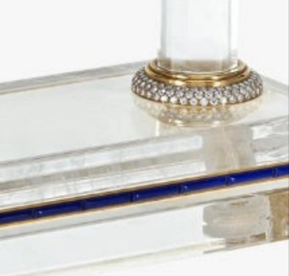 Diamond Mystery Clock Floating 2,150 grams of 18K yellow gold and it is adorned with an array of exceptional gemstones: two pear-shaped diamonds (3.02 and 1.79 carats), 49.96 carats of round-cut diamonds and 9.60 carats of cabochon emeralds.