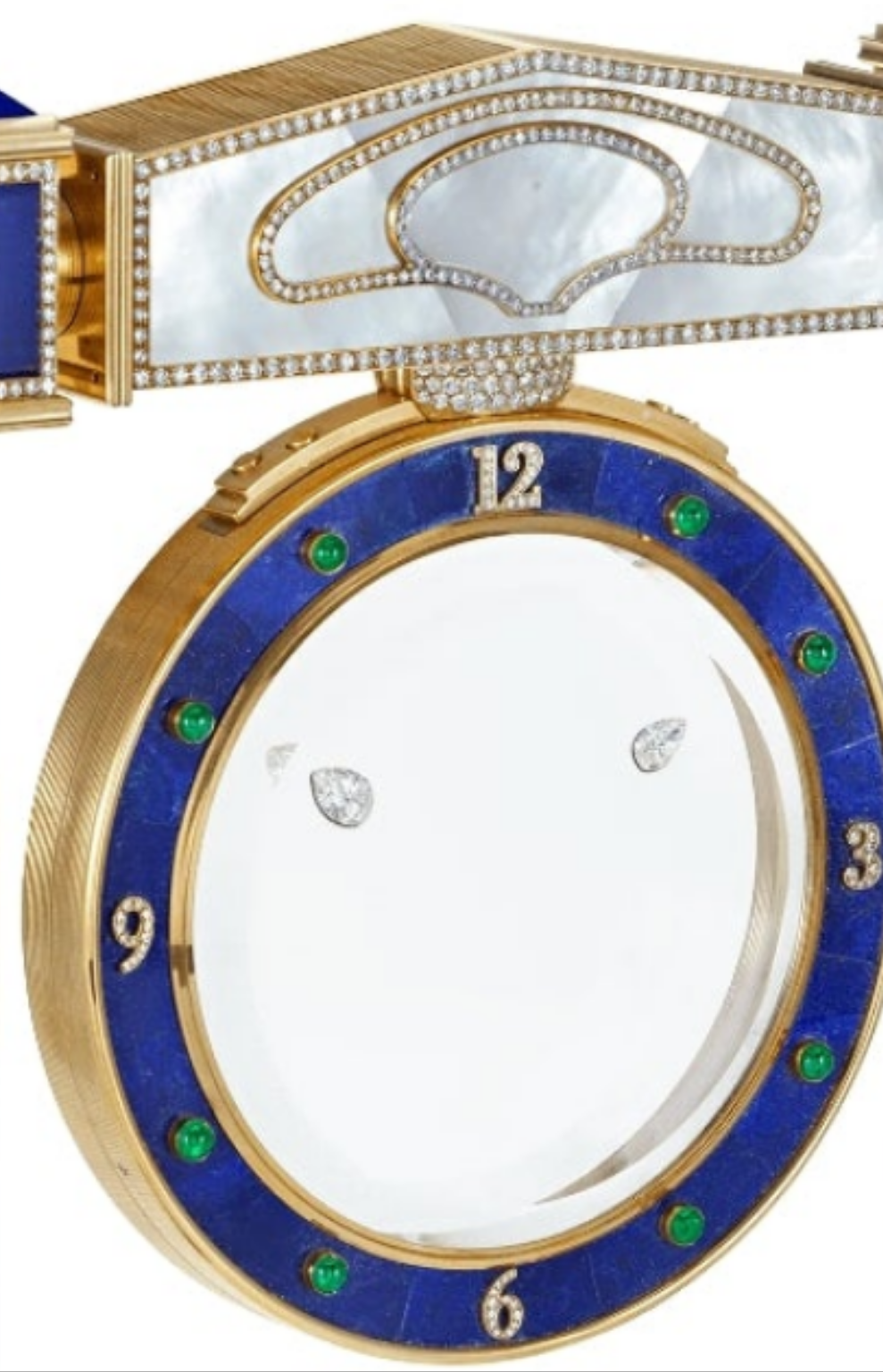 Diamond Mystery Clock Floating 2,150 grams of 18K yellow gold and it is adorned with an array of exceptional gemstones: two pear-shaped diamonds (3.02 and 1.79 carats), 49.96 carats of round-cut diamonds and 9.60 carats of cabochon emeralds.