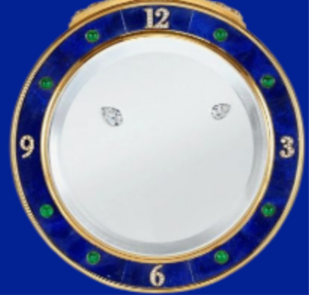 Diamond Mystery Clock Floating 2,150 grams of 18K yellow gold and it is adorned with an array of exceptional gemstones: two pear-shaped diamonds (3.02 and 1.79 carats), 49.96 carats of round-cut diamonds and 9.60 carats of cabochon emeralds.