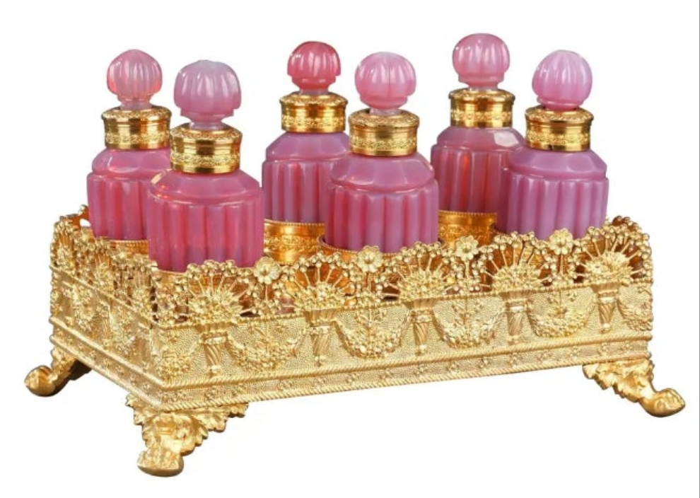 Gilt bronze perfume box with opaline "gorge de pigeon" flasks first 19th century crystal