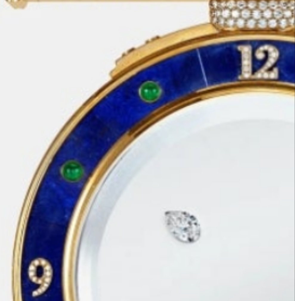 Diamond Mystery Clock Floating 2,150 grams of 18K yellow gold and it is adorned with an array of exceptional gemstones: two pear-shaped diamonds (3.02 and 1.79 carats), 49.96 carats of round-cut diamonds and 9.60 carats of cabochon emeralds.