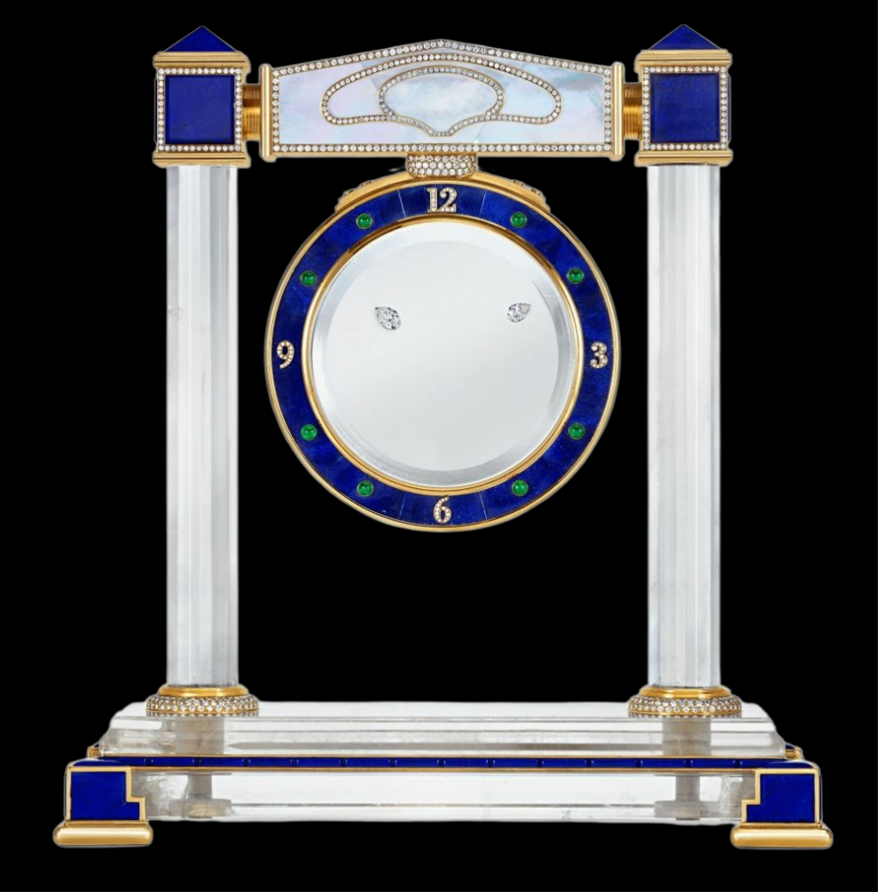 Diamond Mystery Clock Floating 2,150 grams of 18K yellow gold and it is adorned with an array of exceptional gemstones: two pear-shaped diamonds (3.02 and 1.79 carats), 49.96 carats of round-cut diamonds and 9.60 carats of cabochon emeralds.